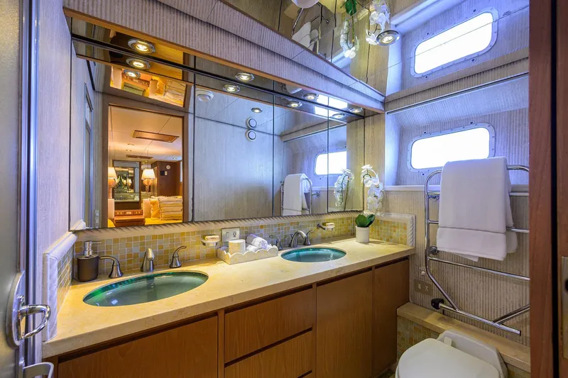  Yacht Photos Pics Luxurious 1985 Feadship Yacht Fisherman bathroom with dual sinks and elegant decor.