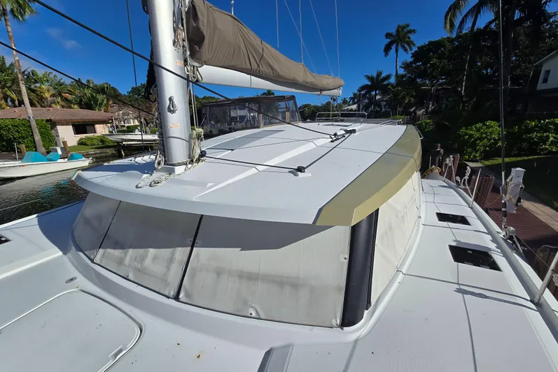 Waterlilly Yacht Photos Pics 2017 Fountaine Pajot Lucia 40 catamaran docked, showcasing sleek design and spacious deck.