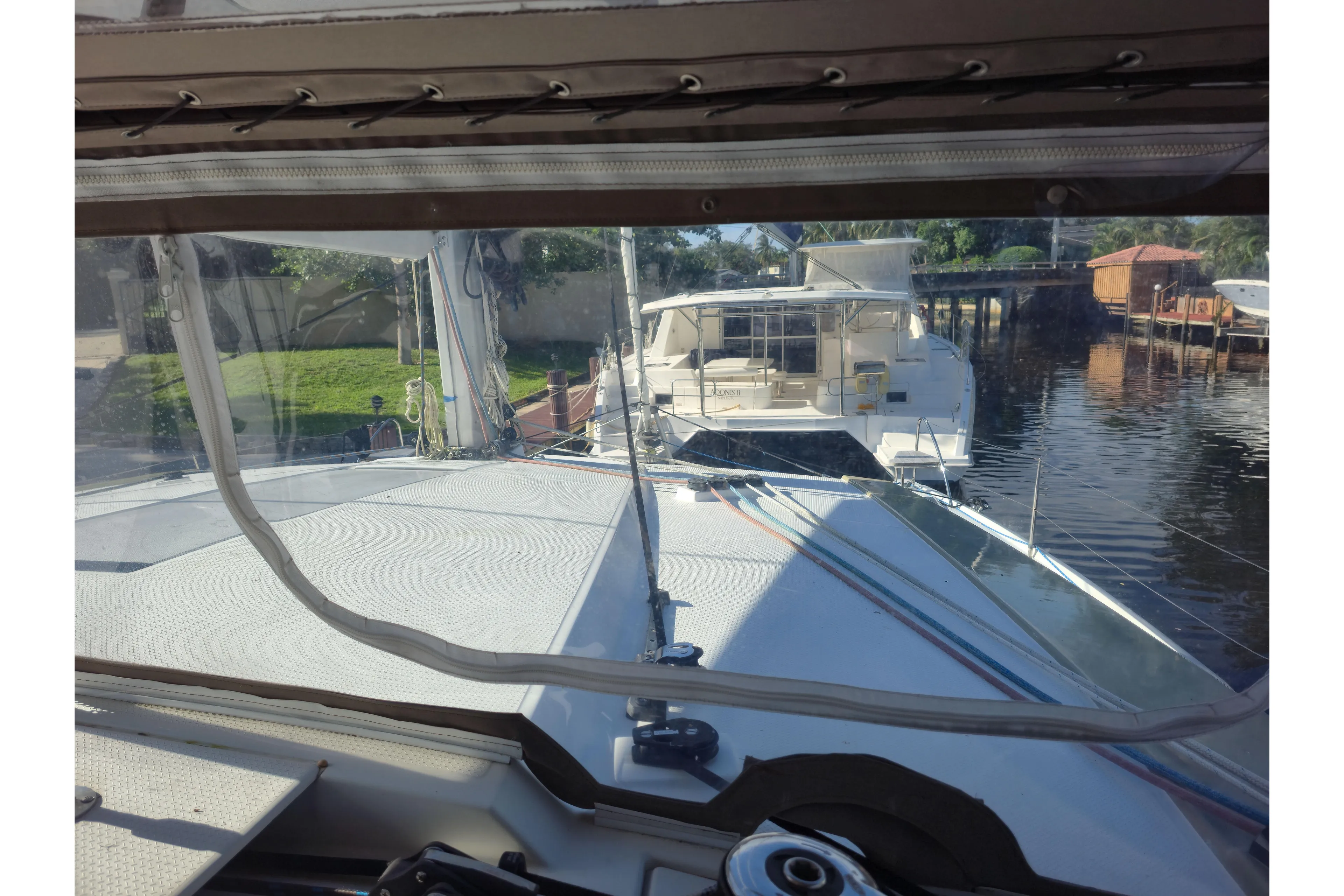 Waterlilly Yacht Photos Pics 2017 Fountaine Pajot Lucia 40 catamaran docked, viewed from the cockpit.