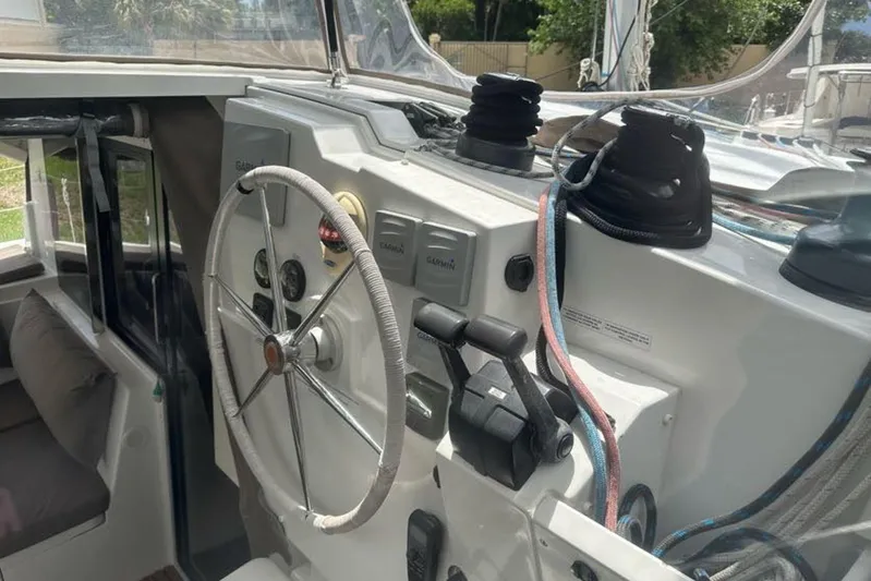 Waterlilly Yacht Photos Pics Helm of 2017 Fountaine Pajot Lucia 40 catamaran with steering wheel and control panel.
