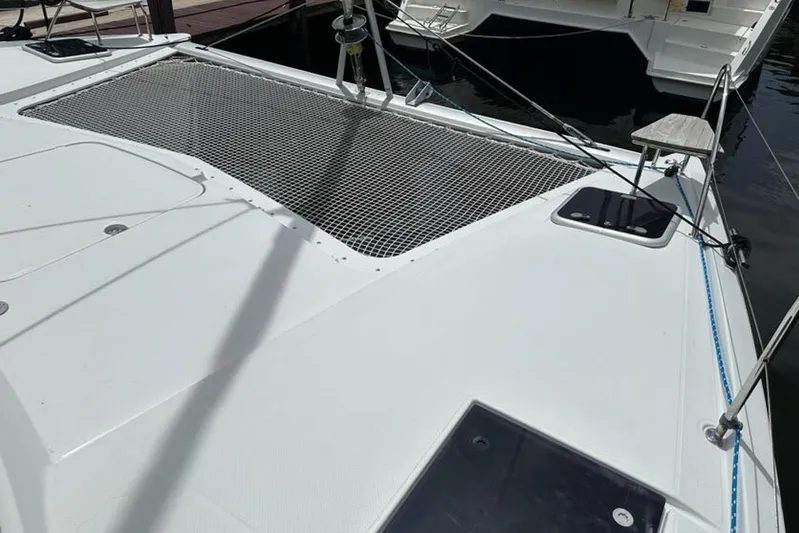 Waterlilly Yacht Photos Pics 2017 Fountaine Pajot Lucia 40 catamaran deck with netting and mooring lines.