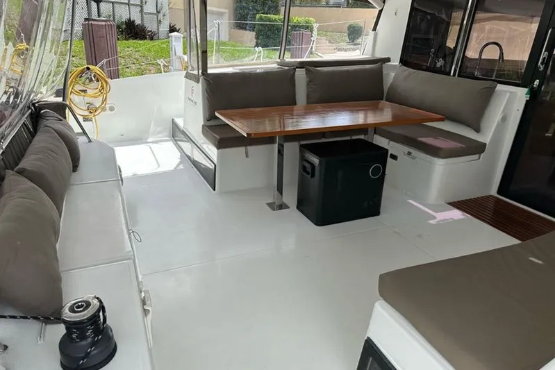 Waterlilly Yacht Photos Pics 2017 Fountaine Pajot Lucia 40 yacht interior with seating and dining area.