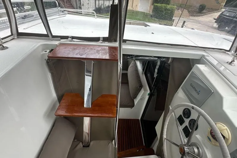 Waterlilly Yacht Photos Pics 2017 Fountaine Pajot Lucia 40 yacht helm with Garmin navigation system and wooden accents.