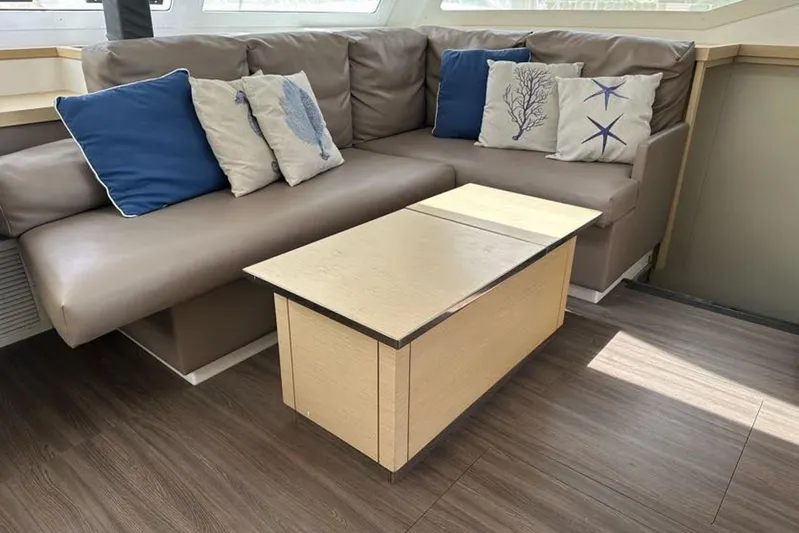 Waterlilly Yacht Photos Pics Luxurious interior of 2017 Fountaine Pajot Lucia 40 with cozy seating and decorative pillows.