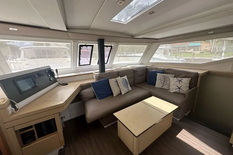 Waterlilly Yacht Photos Pics 2017 Fountaine Pajot Lucia 40 interior with cozy seating and navigation station.