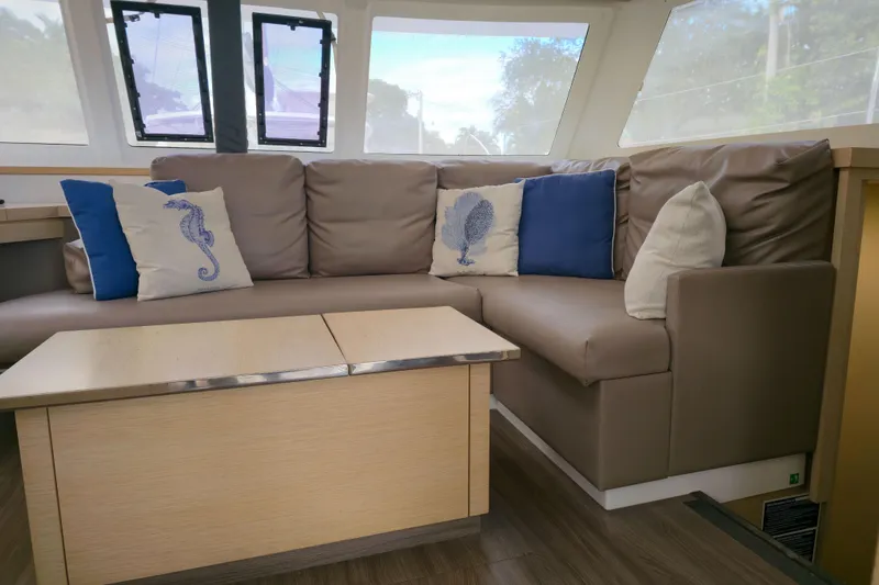 Waterlilly Yacht Photos Pics Interior of 2017 Fountaine Pajot Lucia 40 yacht with cozy seating and decorative pillows.