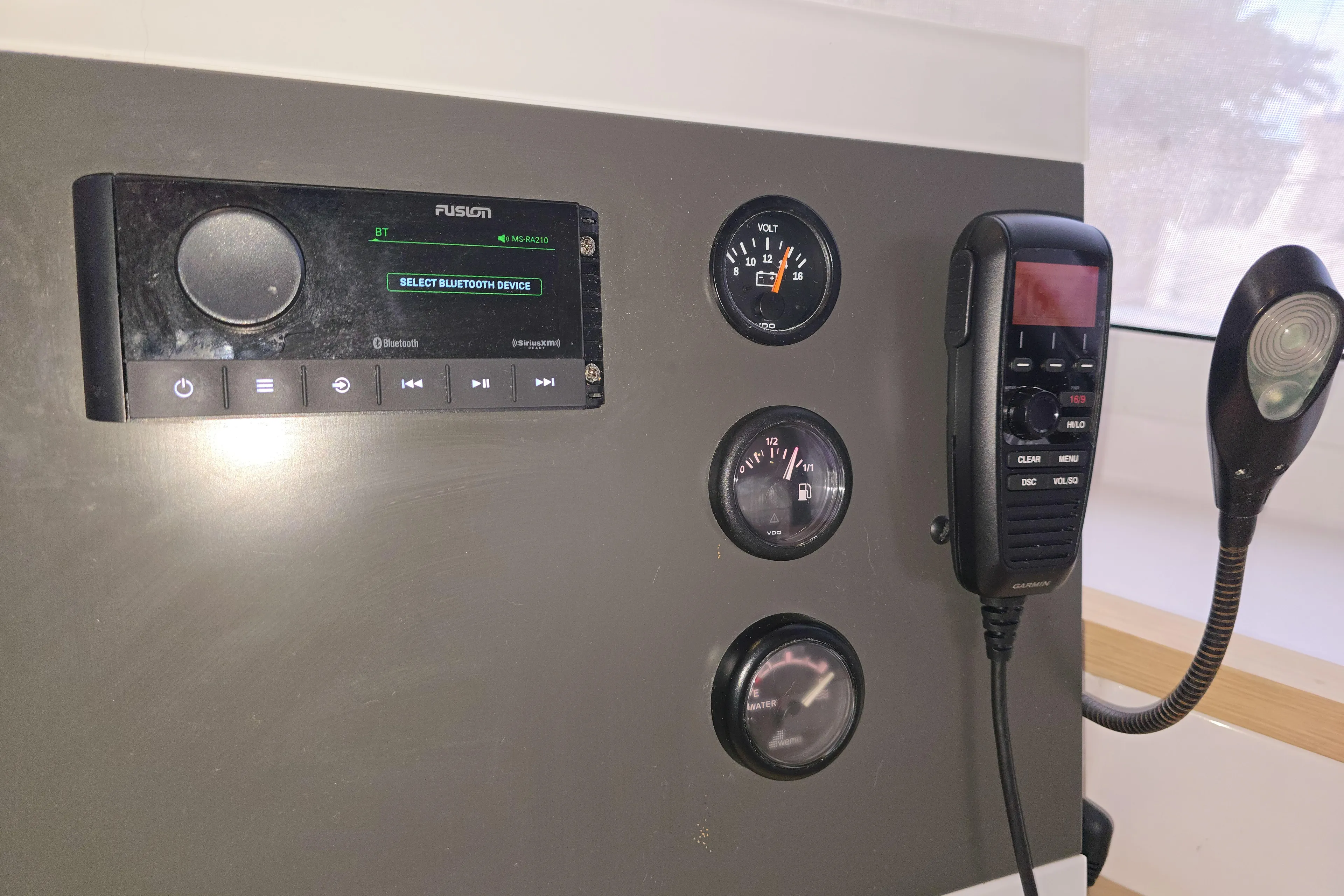 Waterlilly Yacht Photos Pics Control panel of a 2017 Fountaine Pajot Lucia 40 with gauges and communication devices.
