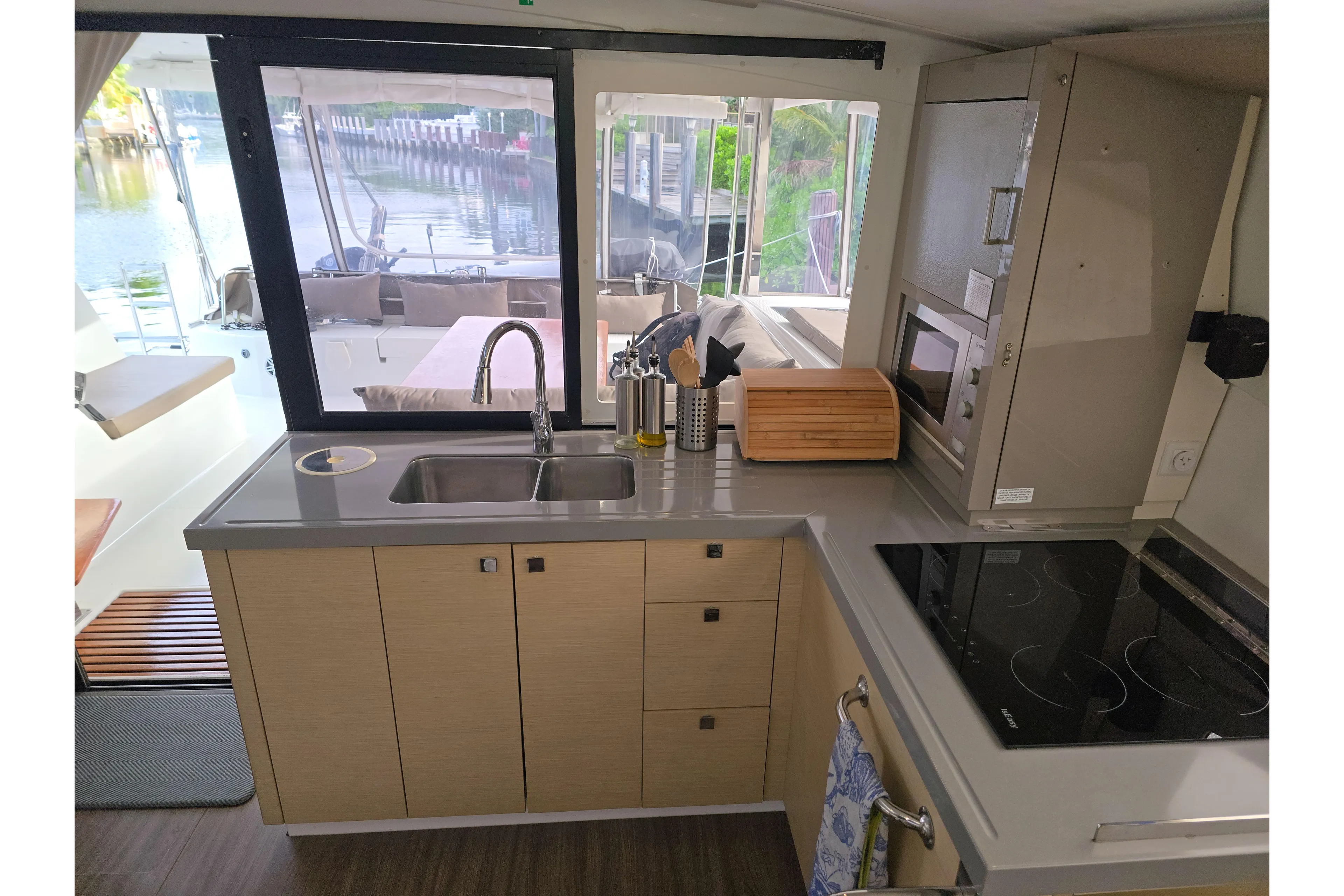 Waterlilly Yacht Photos Pics Modern kitchen interior of 2017 Fountaine Pajot Lucia 40 catamaran with sleek design.