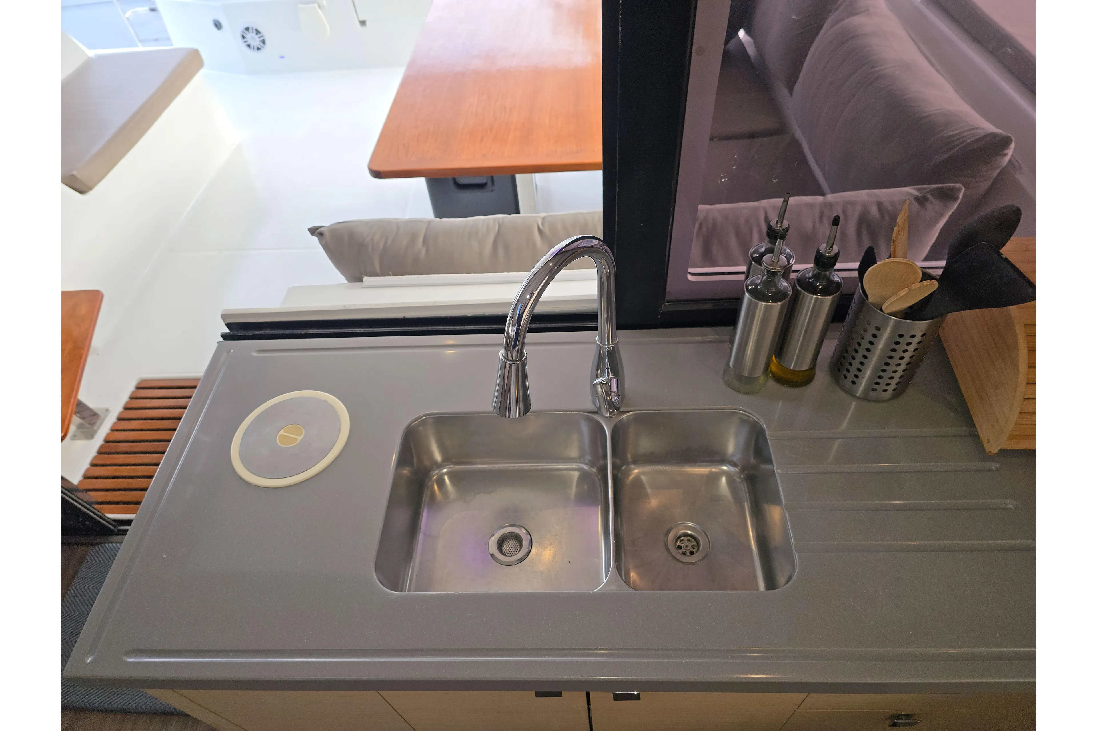 Waterlilly Yacht Photos Pics Modern kitchen sink on 2017 Fountaine Pajot Lucia 40 catamaran, with utensils and oil bottles.