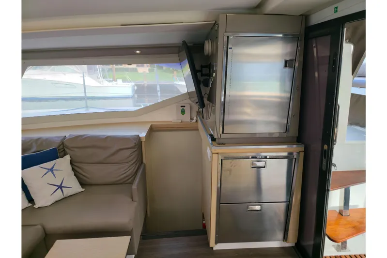 Waterlilly Yacht Photos Pics Interior of 2017 Fountaine Pajot Lucia 40 catamaran with modern seating and stainless steel appliances.