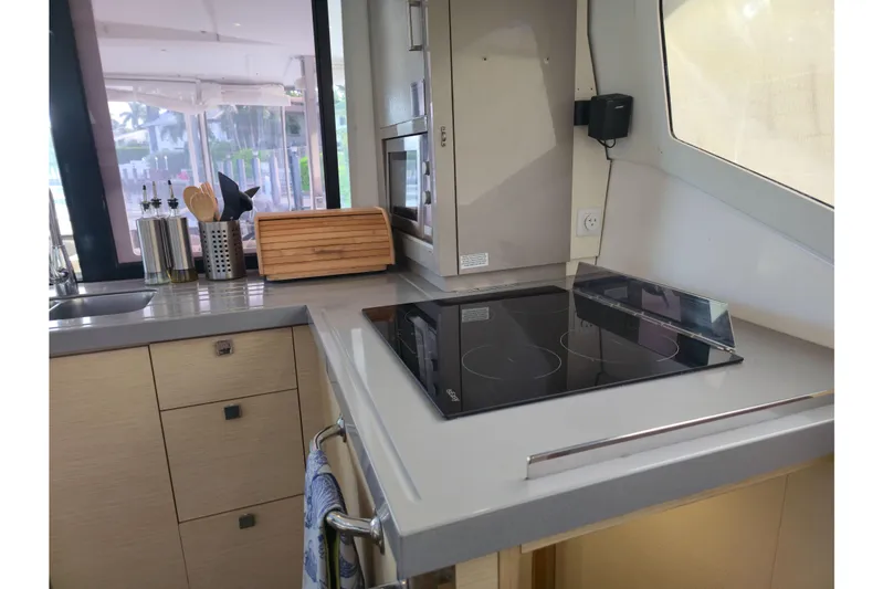 Waterlilly Yacht Photos Pics Modern kitchen interior of 2017 Fountaine Pajot Lucia 40 catamaran with sleek appliances.