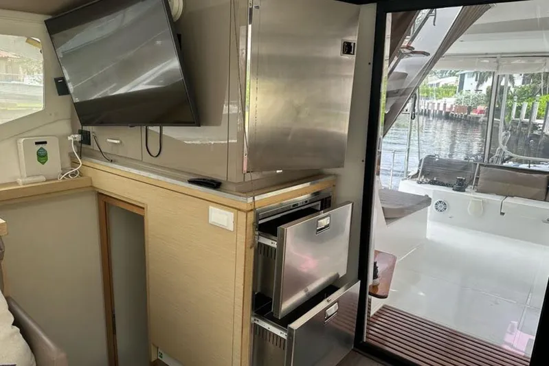 Waterlilly Yacht Photos Pics Interior of 2017 Fountaine Pajot Lucia 40 catamaran with modern kitchen and outdoor view.