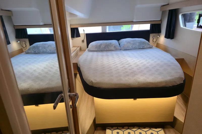 Waterlilly Yacht Photos Pics Luxurious bedroom interior of 2017 Fountaine Pajot Lucia 40 catamaran with cozy bedding.