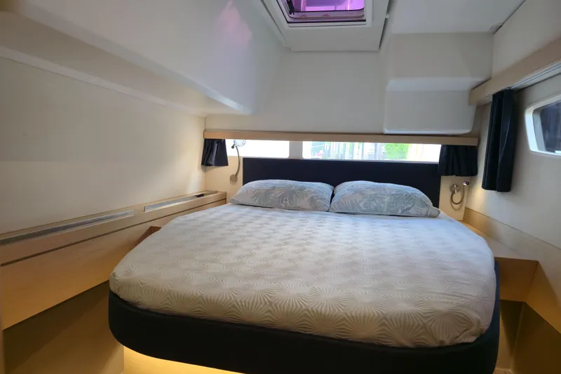 Waterlilly Yacht Photos Pics Luxurious cabin interior of 2017 Fountaine Pajot Lucia 40 catamaran with cozy bed and modern design.