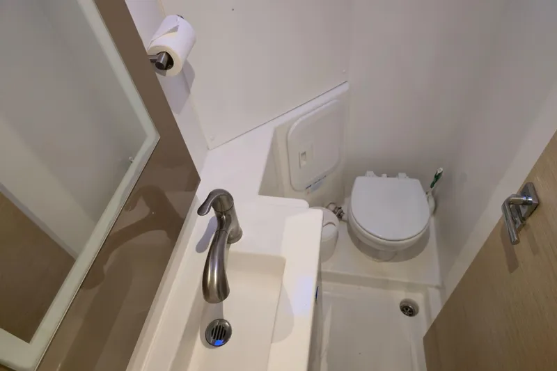 Waterlilly Yacht Photos Pics Bathroom interior of 2017 Fountaine Pajot Lucia 40 catamaran, featuring sink and toilet.