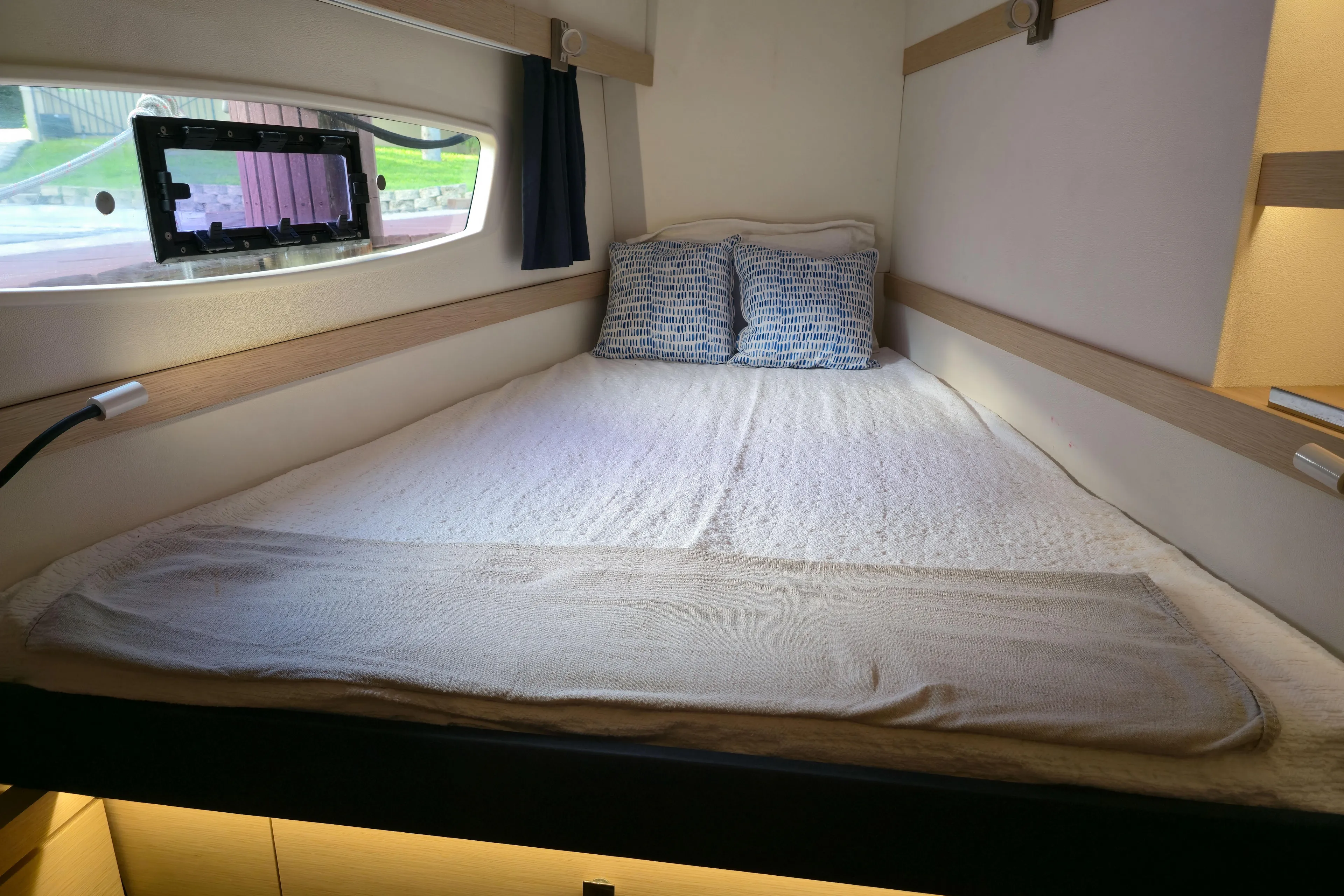 Waterlilly Yacht Photos Pics Cozy cabin interior of 2017 Fountaine Pajot Lucia 40 catamaran with double bed.