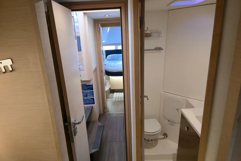 Waterlilly Yacht Photos Pics Interior of 2017 Fountaine Pajot Lucia 40, featuring a compact bathroom and cozy bedroom.