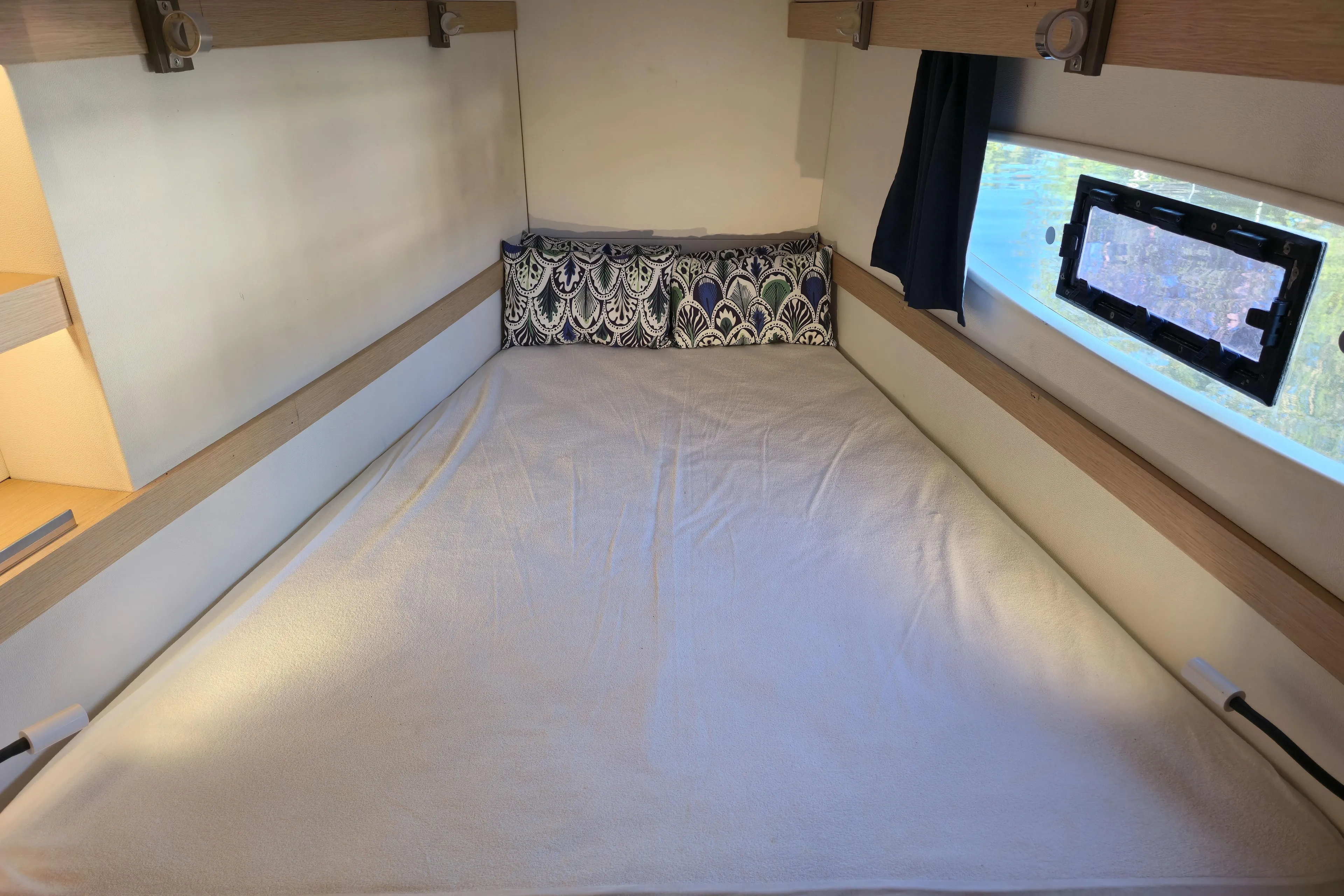 Waterlilly Yacht Photos Pics Cozy cabin bed in 2017 Fountaine Pajot Lucia 40 catamaran with window view.
