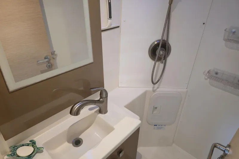 Waterlilly Yacht Photos Pics Bathroom interior of 2017 Fountaine Pajot Lucia 40 catamaran, featuring sink and shower.