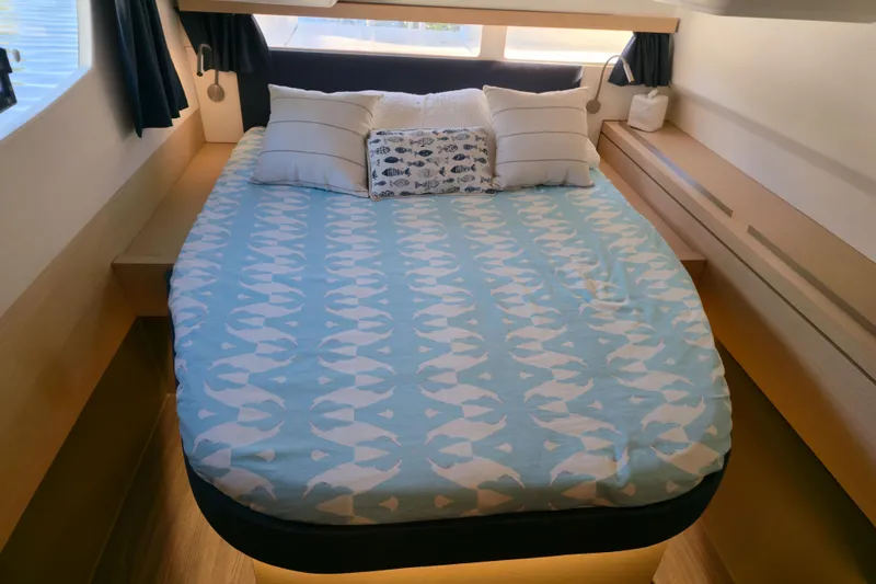 Waterlilly Yacht Photos Pics Cozy bedroom in 2017 Fountaine Pajot Lucia 40 catamaran with nautical-themed bedding.
