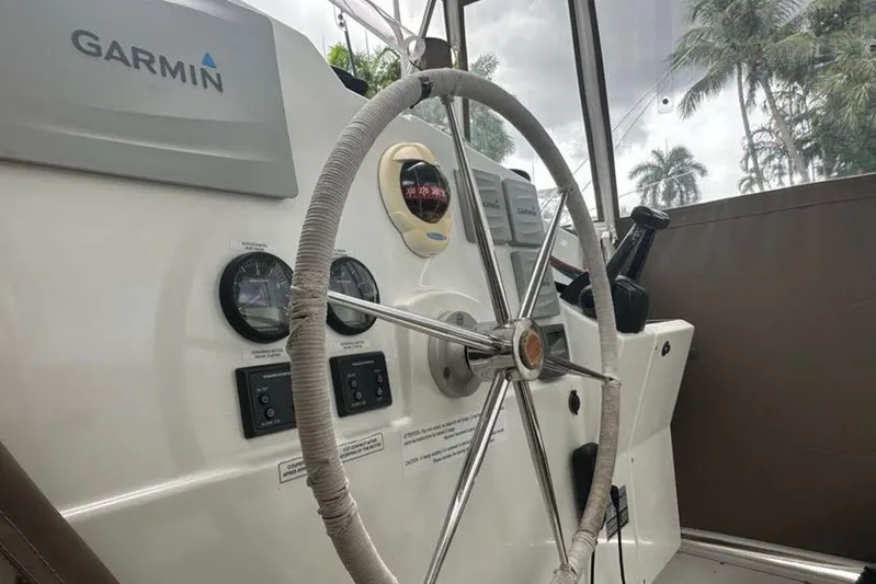 Waterlilly Yacht Photos Pics Steering wheel and controls of 2017 Fountaine Pajot Lucia 40 catamaran with Garmin navigation.
