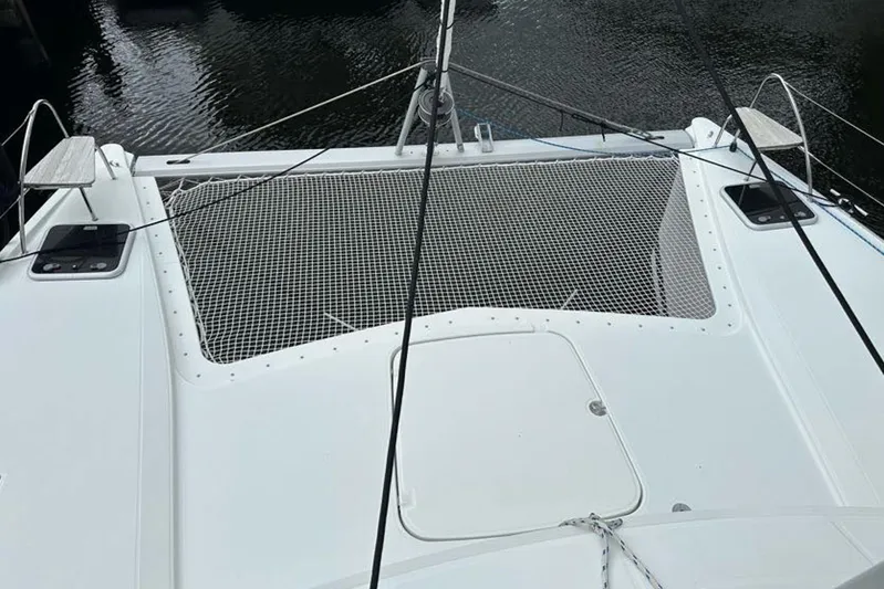Waterlilly Yacht Photos Pics 2017 Fountaine Pajot Lucia 40 catamaran deck with netting over water.