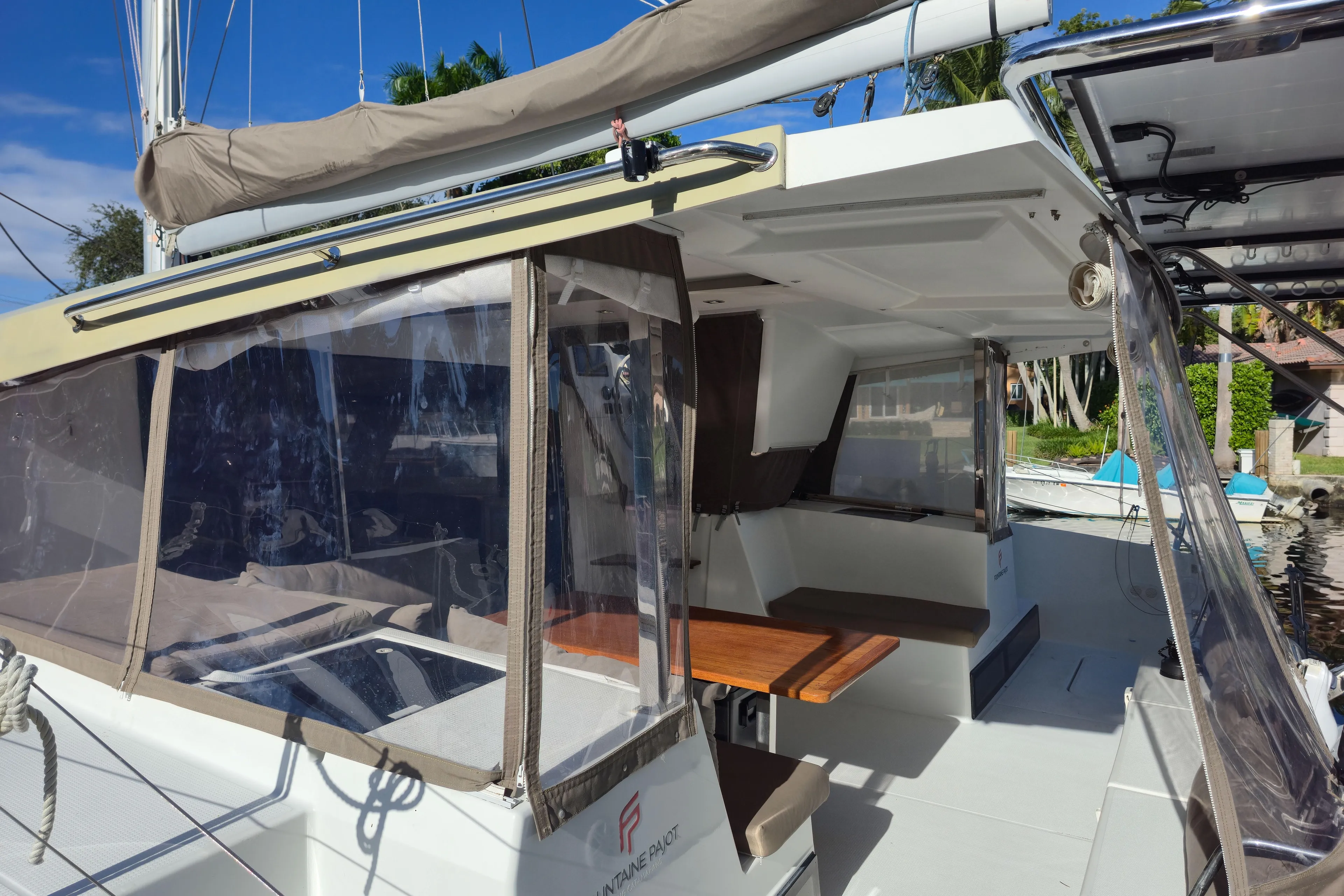Waterlilly Yacht Photos Pics 2017 Fountaine Pajot Lucia 40 catamaran with covered cockpit and seating area.