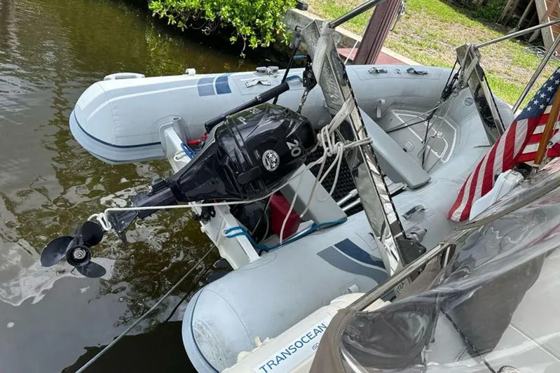 Waterlilly Yacht Photos Pics Inflatable boat with outboard motor docked beside 2017 Fountaine Pajot Lucia 40 catamaran.