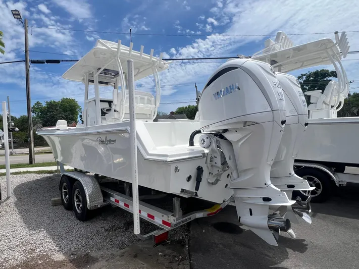  Yacht Photos Pics 2026 Pair Customs 27 Center Console boat on trailer, featuring dual Yamaha engines.