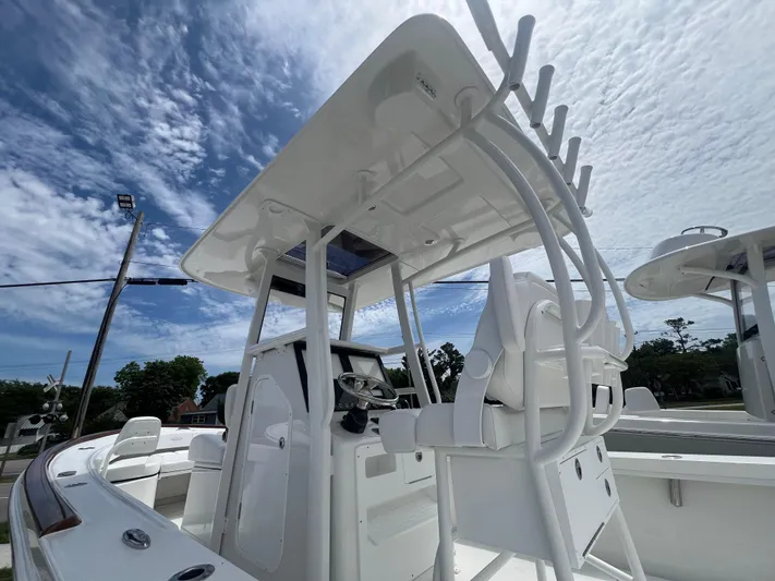  Yacht Photos Pics 2026 Pair Customs 27 Center Console boat with sleek design under a partly cloudy sky.
