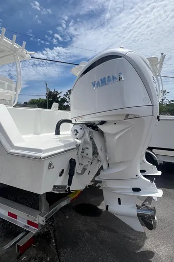  Yacht Photos Pics 2026 Pair Customs 27 Center Console boat with Yamaha outboard motor, parked on a trailer.