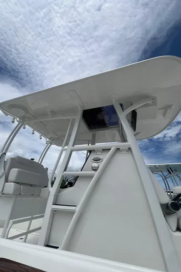  Yacht Photos Pics 2026 Pair Customs 27 Center Console boat with sleek design under a cloudy sky.