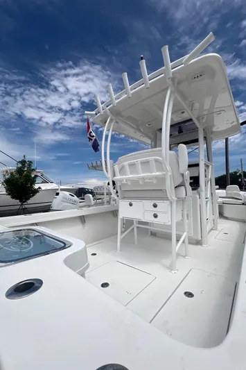  Yacht Photos Pics 2026 Pair Customs 27 Center Console boat with sleek white design under a blue sky.