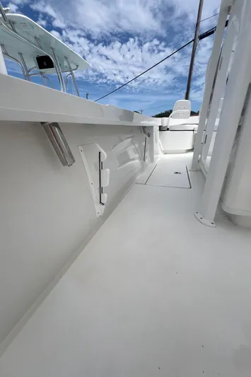  Yacht Photos Pics 2026 Pair Customs 27 Center Console boat, sleek white deck under a vibrant blue sky.