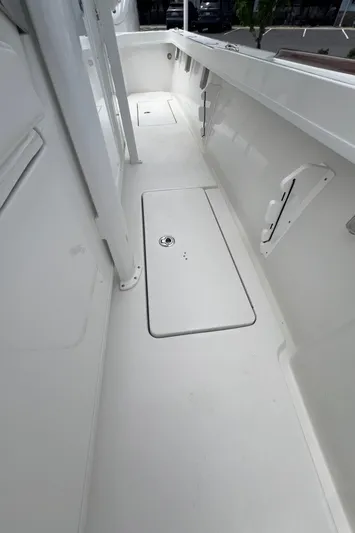  Yacht Photos Pics 2026 Pair Customs 27 Center Console boat interior, featuring sleek white deck design.
