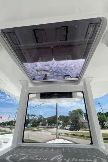  Yacht Photos Pics 2026 Pair Customs 27 Center Console boat interior with sunroof and clear view.