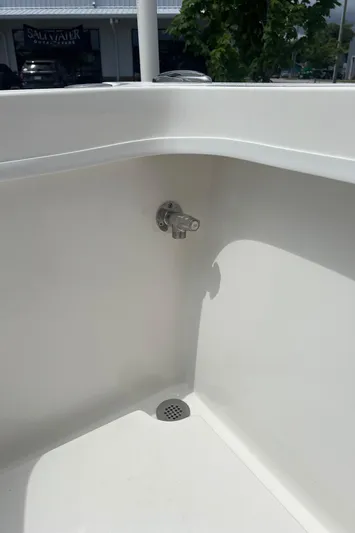  Yacht Photos Pics 2026 Pair Customs 27 Center Console boat interior with drain and faucet.