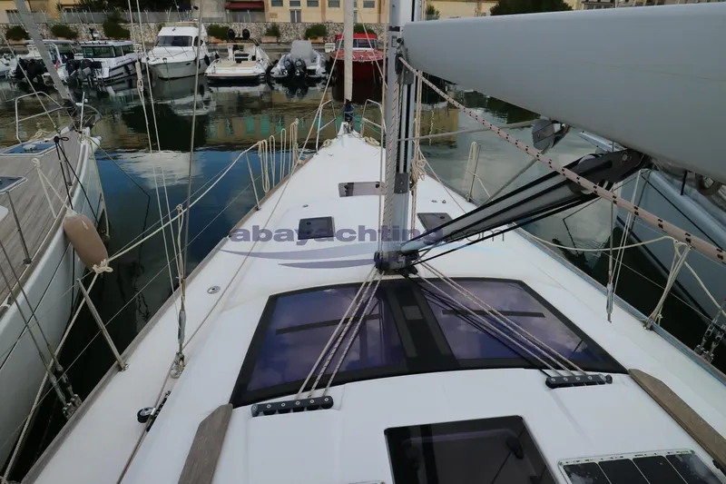  Yacht Photos Pics 2018 Dufour 412 Grand Large sailboat docked in a marina, showcasing deck and rigging.
