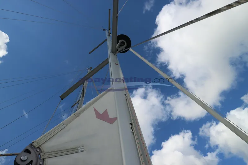  Yacht Photos Pics Dufour 412 Grand Large 2018 sailboat mast against blue sky with clouds.