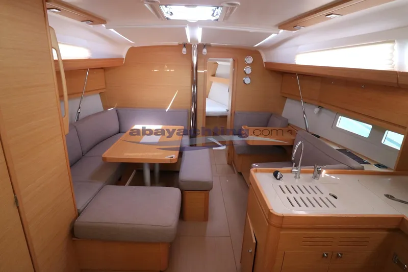  Yacht Photos Pics Interior of 2018 Dufour 412 Grand Large yacht with modern kitchen and seating area.