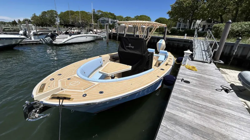  Yacht Photos Pics 2025 Lilybaeum Levenzo boat docked at marina, featuring sleek design and wooden deck.