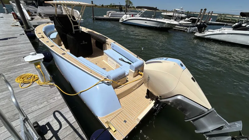  Yacht Photos Pics 2025 Lilybaeum Levenzo boat docked, featuring sleek design and powerful outboard motor.