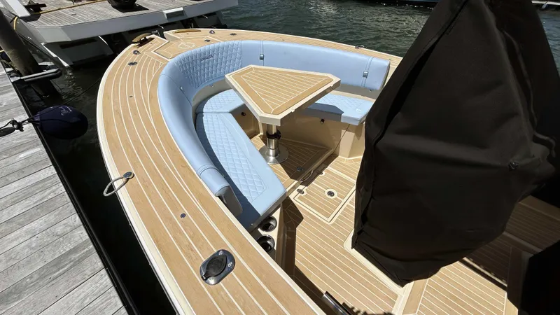  Yacht Photos Pics Luxury Lilybaeum Levenzo 2025 boat with elegant wood deck and cushioned seating.