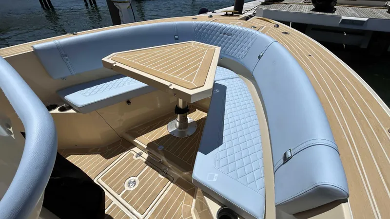  Yacht Photos Pics Luxurious seating area on 2025 Lilybaeum Levenzo boat with elegant wood and leather design.