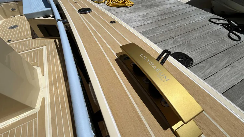  Yacht Photos Pics 2025 Lilybaeum Levenzo boat deck with gold cleat and wooden finish.