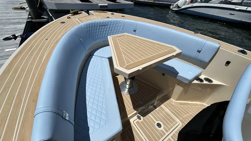  Yacht Photos Pics Luxury seating area on 2025 Lilybaeum Levenzo boat with elegant wood finish.