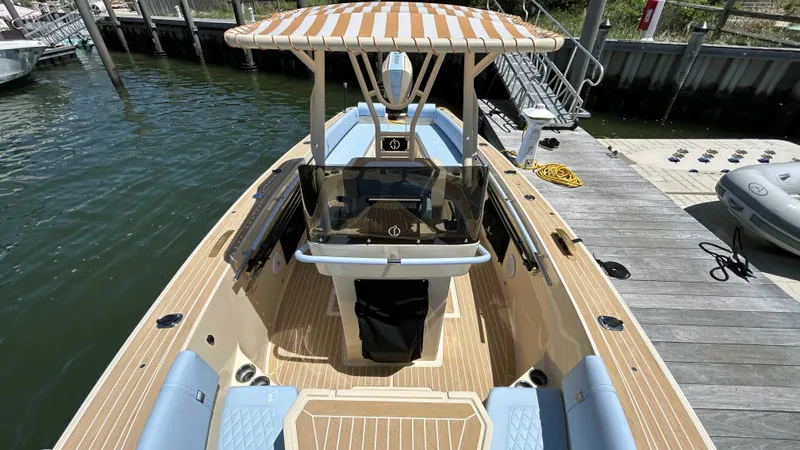  Yacht Photos Pics 2025 Lilybaeum Levenzo boat docked, featuring striped canopy and spacious seating.