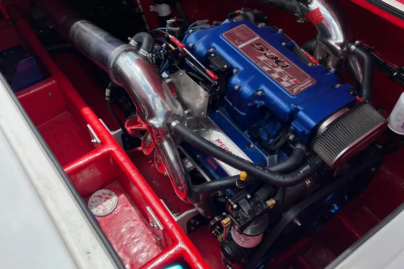  Yacht Photos Pics Engine of a 2004 Spectre 36 Cat boat, featuring a powerful blue motor setup.