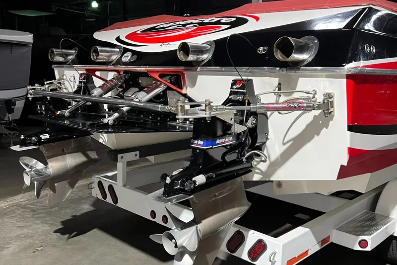  Yacht Photos Pics 2004 Spectre 36 Cat boat with dual propellers and vibrant red, black, and white design.