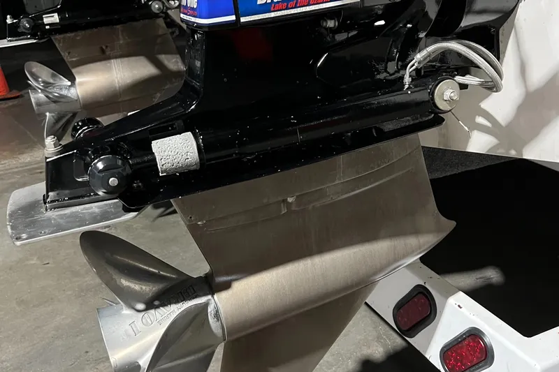  Yacht Photos Pics Propeller and outboard motor of a 2004 Spectre 36 Cat boat in a garage.